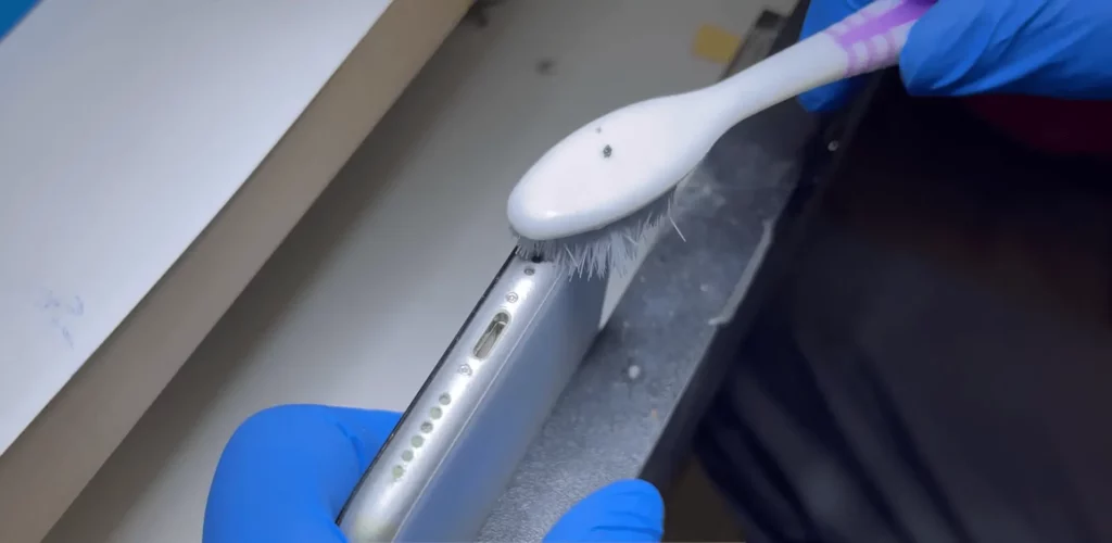 Use ToothBrush with some Rubbing Alcohol - How To Clean My Phones Speaker
